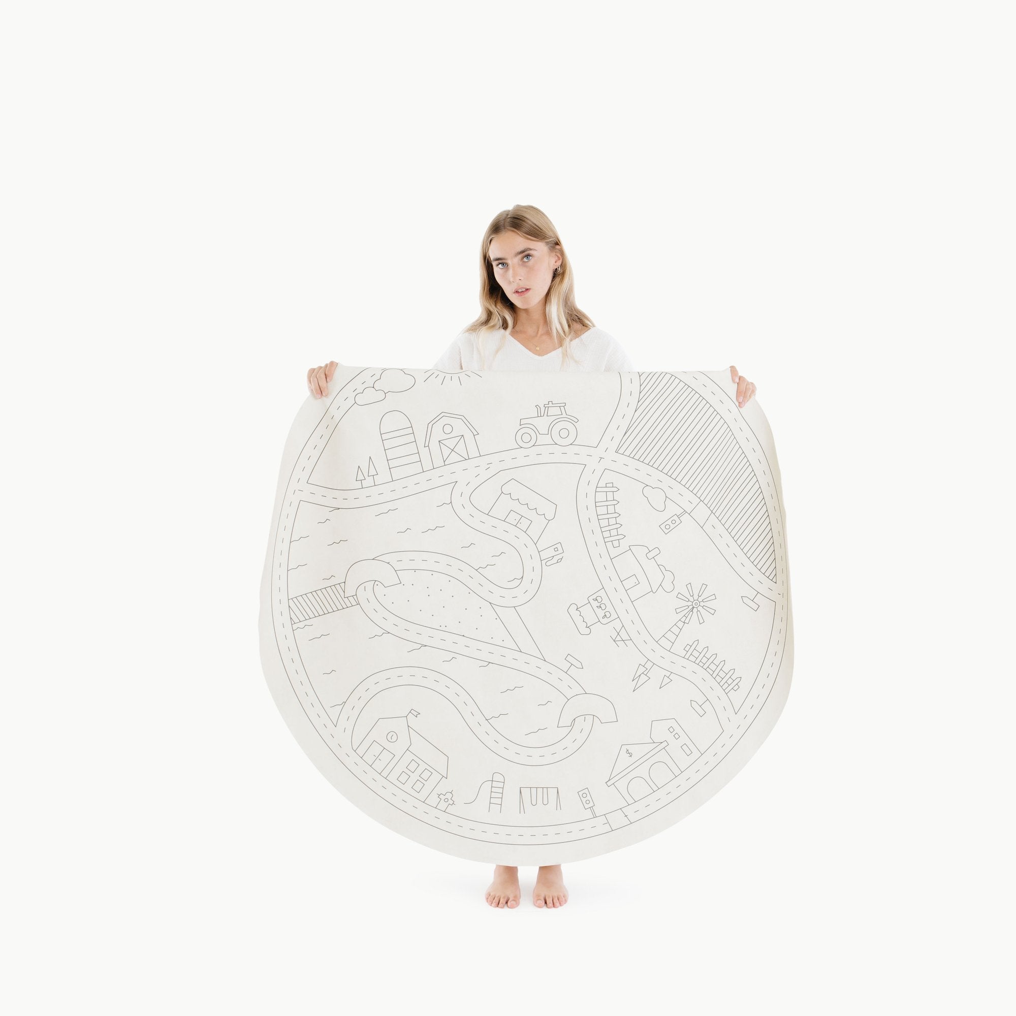 Homestead (on sale) / Circle@Woman holding the Homestead Circle Midi Mat