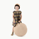 Untanned (on sale) / Circle@Kid holding the Untanned Mini Circle Floor Cushion