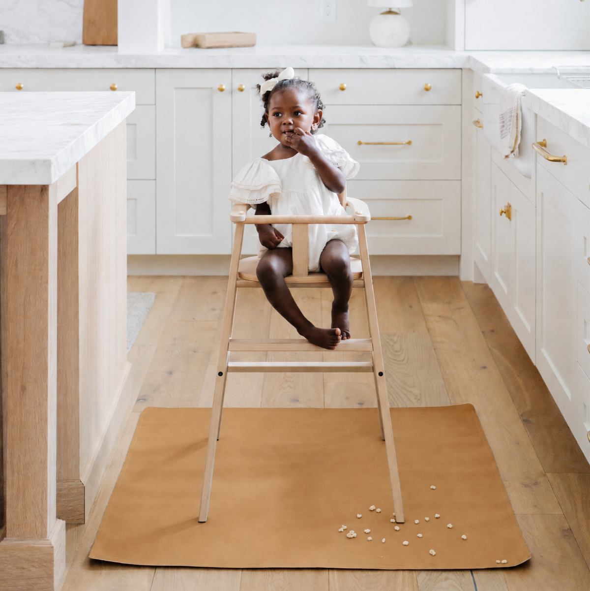 Camel@baby in a highchair on the Camel Mini Mat