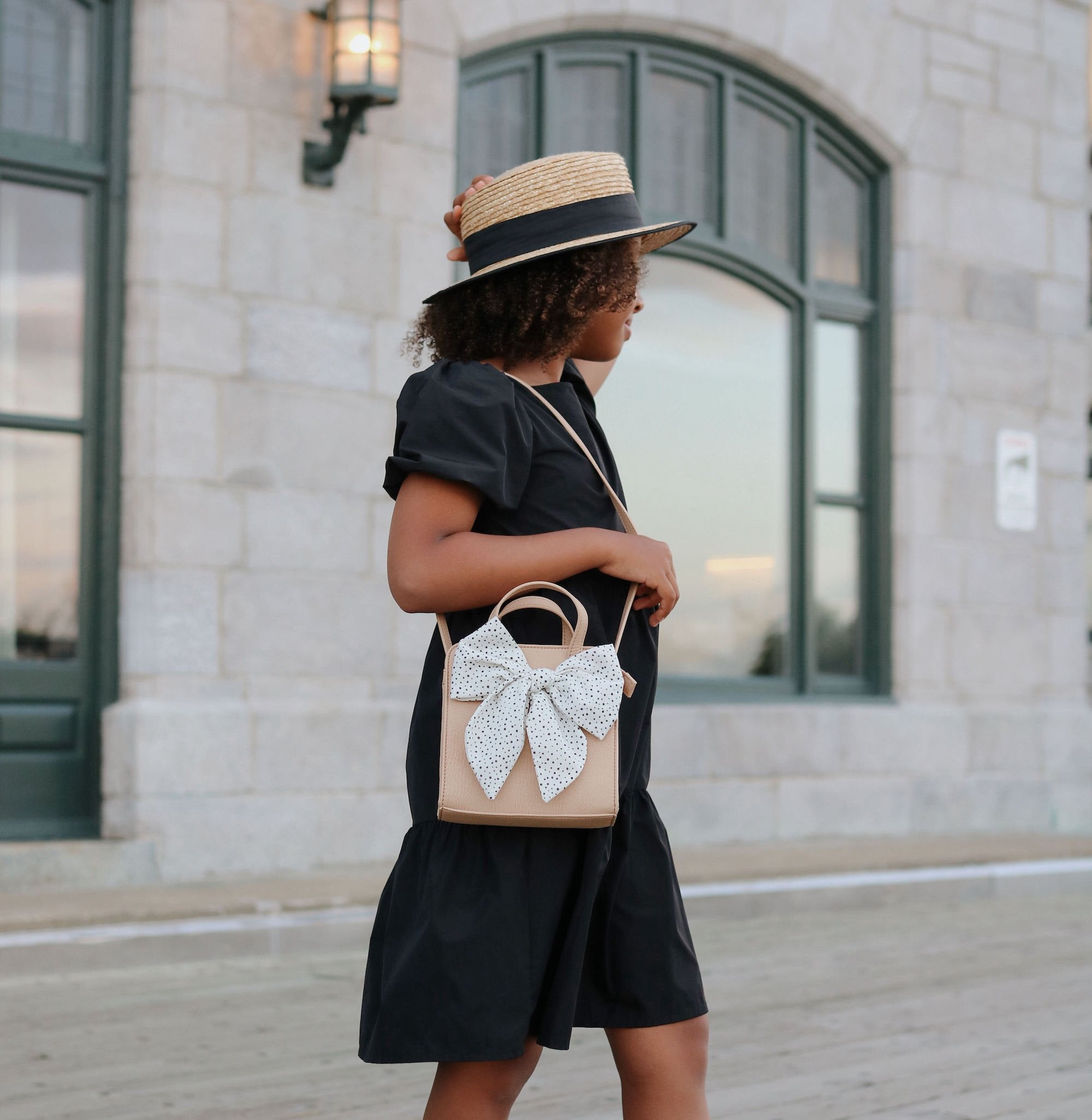 Untanned (on sale)@Little girl outside wearing the Untanned Children's Purse