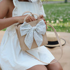 Untanned@Little girl outside looking inside the Untanned Children's Purse