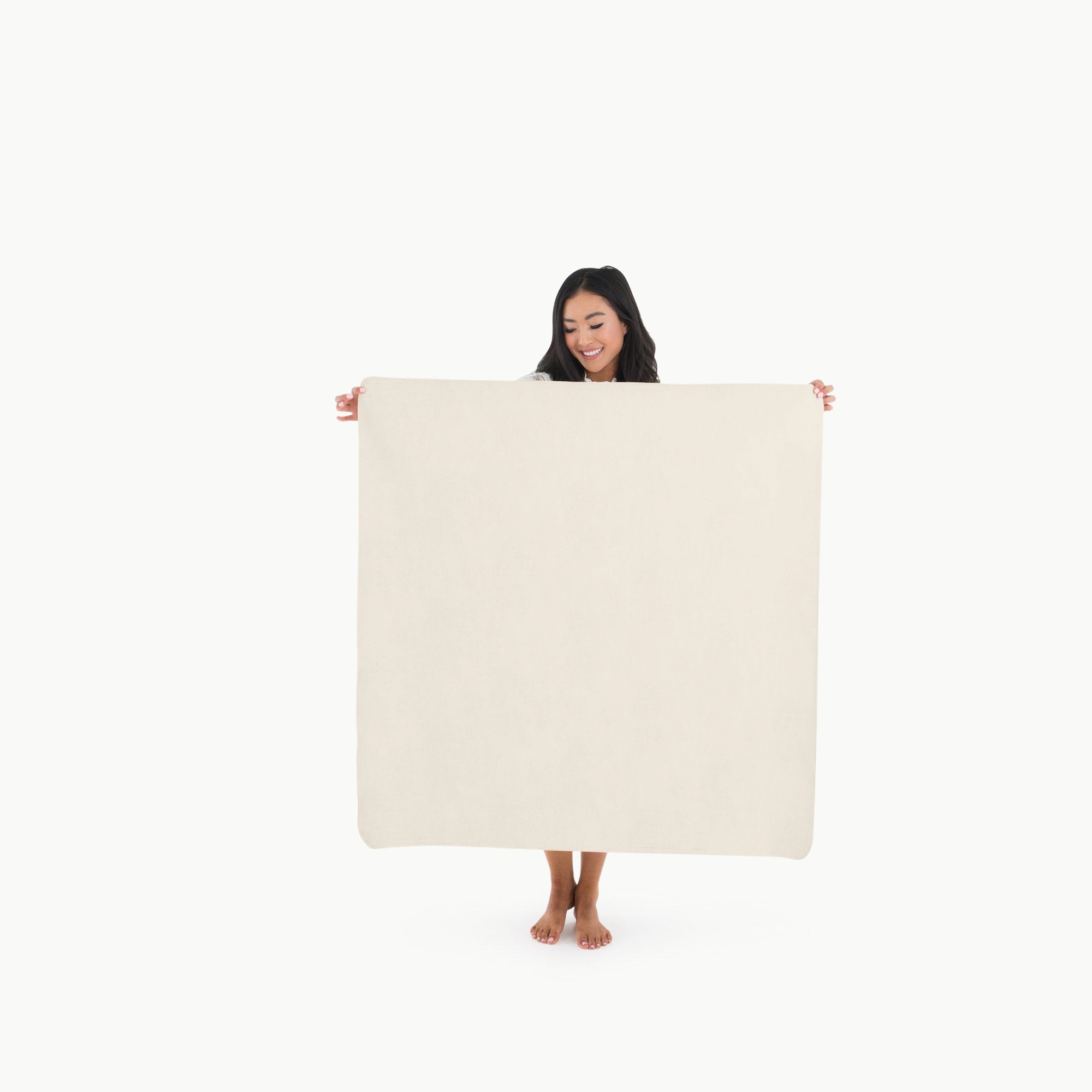 Ivory@Woman holding the Ivory Mini Mat