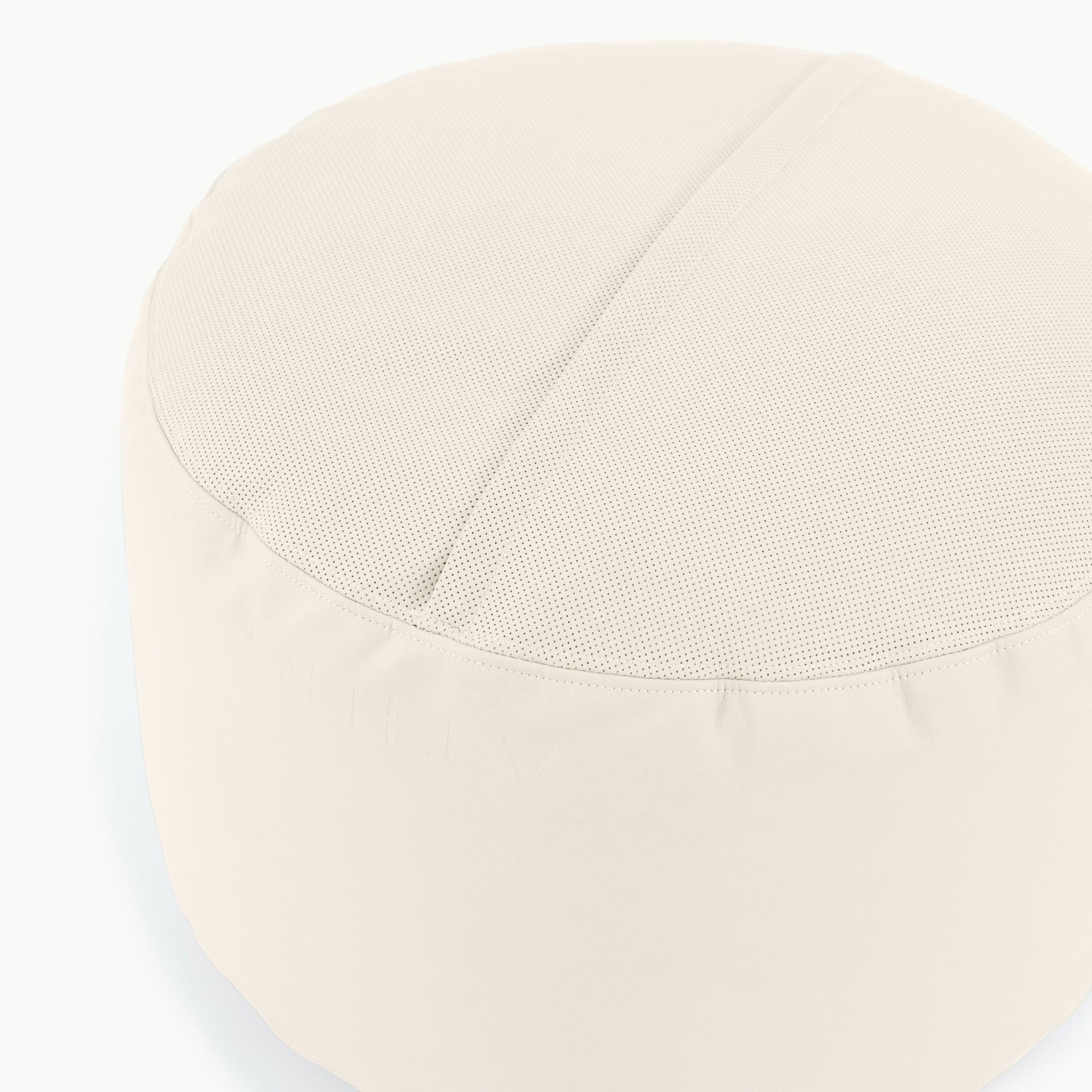 Ivory@Detail shot of perforated side of Ivory Circle Pouf