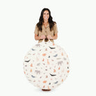 Menagerie / Circle@woman holding the Menagerie Circle Floor Cushion