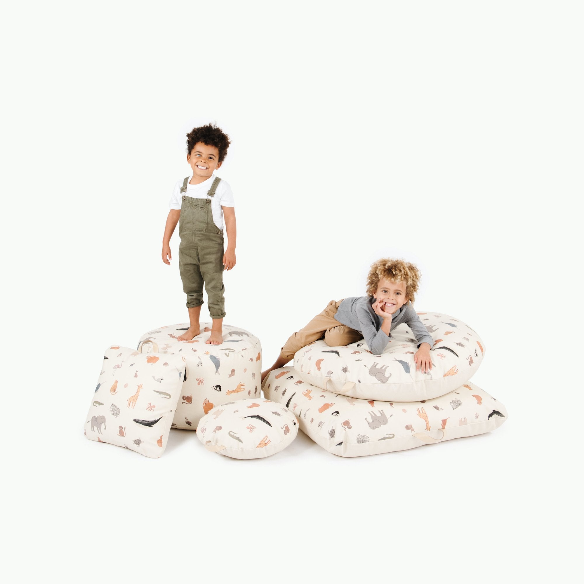 Menagerie@Little kids laying on Menagerie products