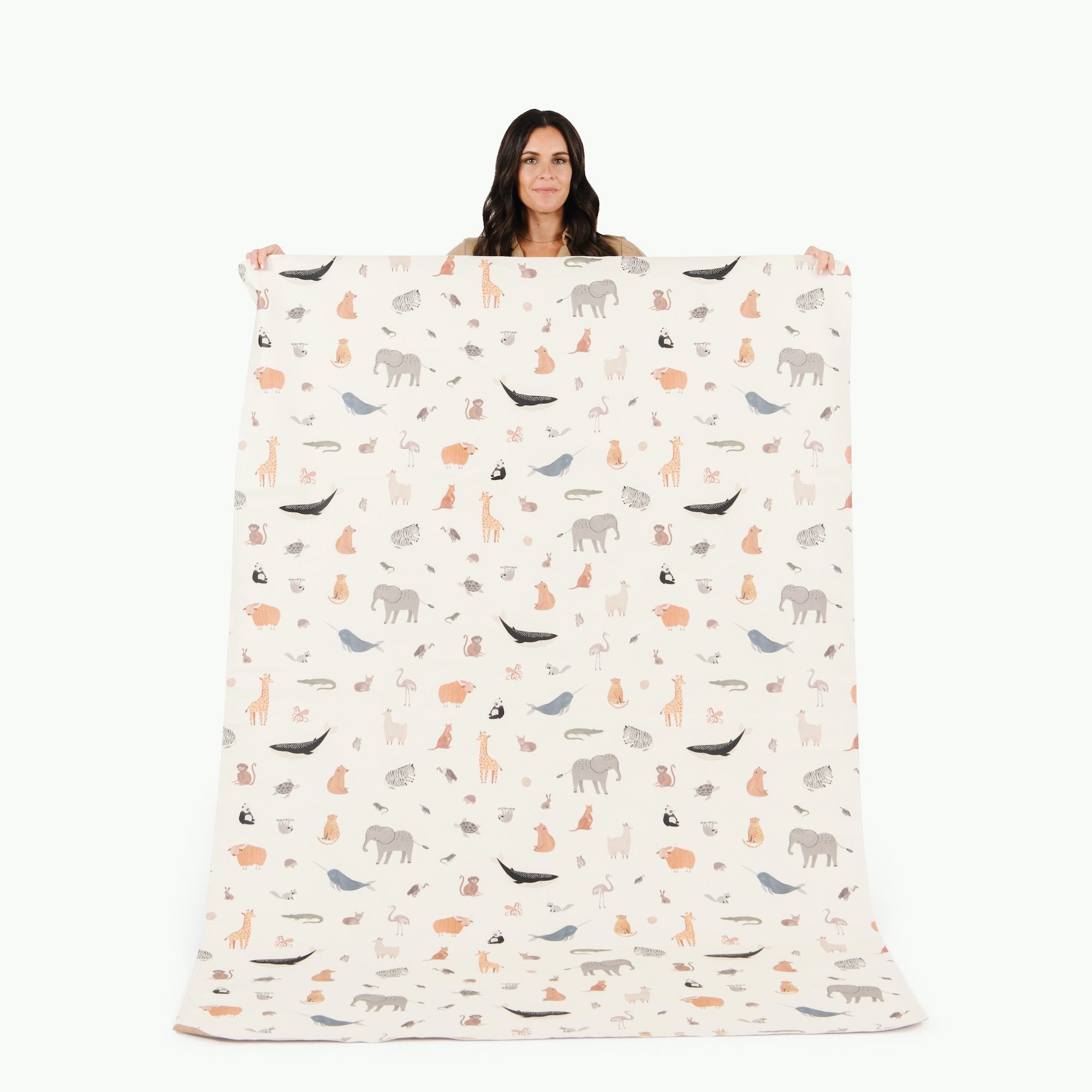 Menagerie (on sale)@Woman holding the Menagerie Midi+ Mat