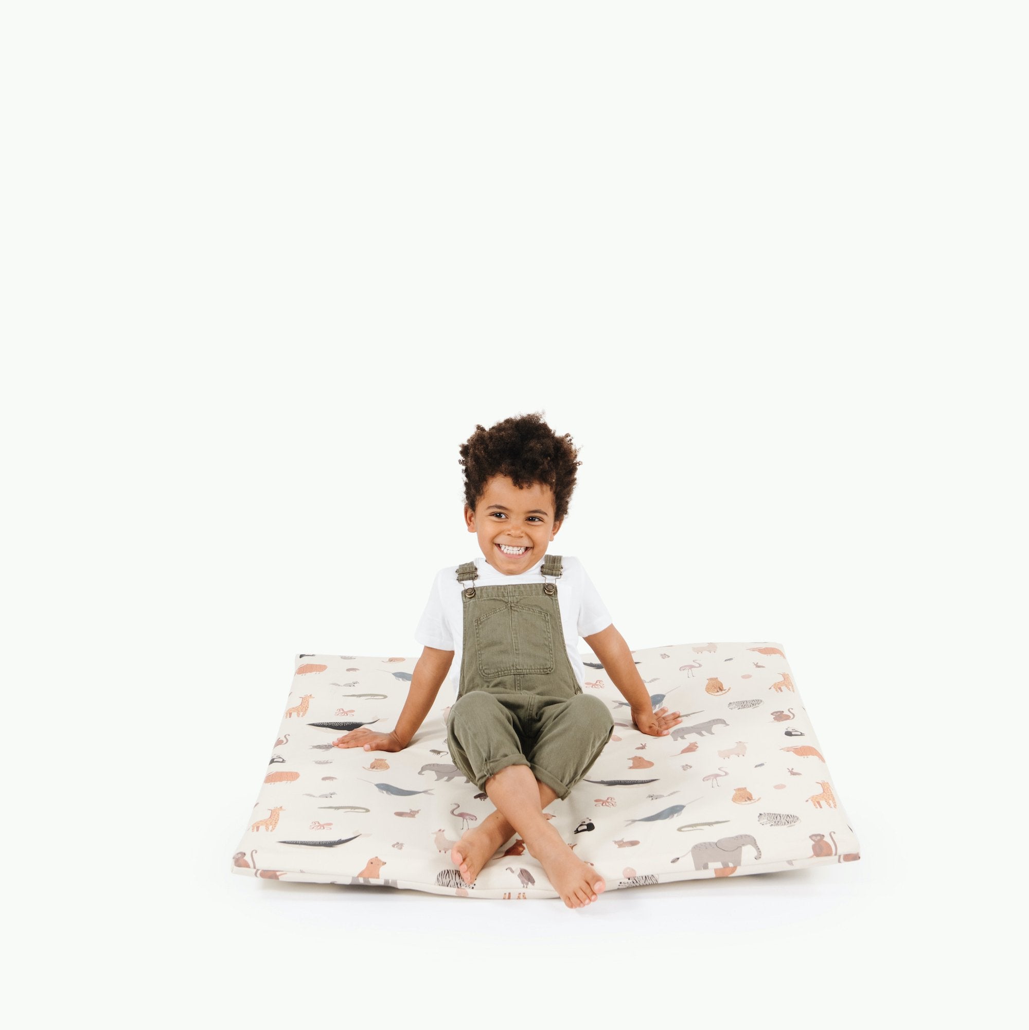 Menagerie / Square@Boy sitting on Menagerie Padded Mini Square