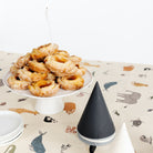 Menagerie (on sale)@close up of menagerie tablecloth on table