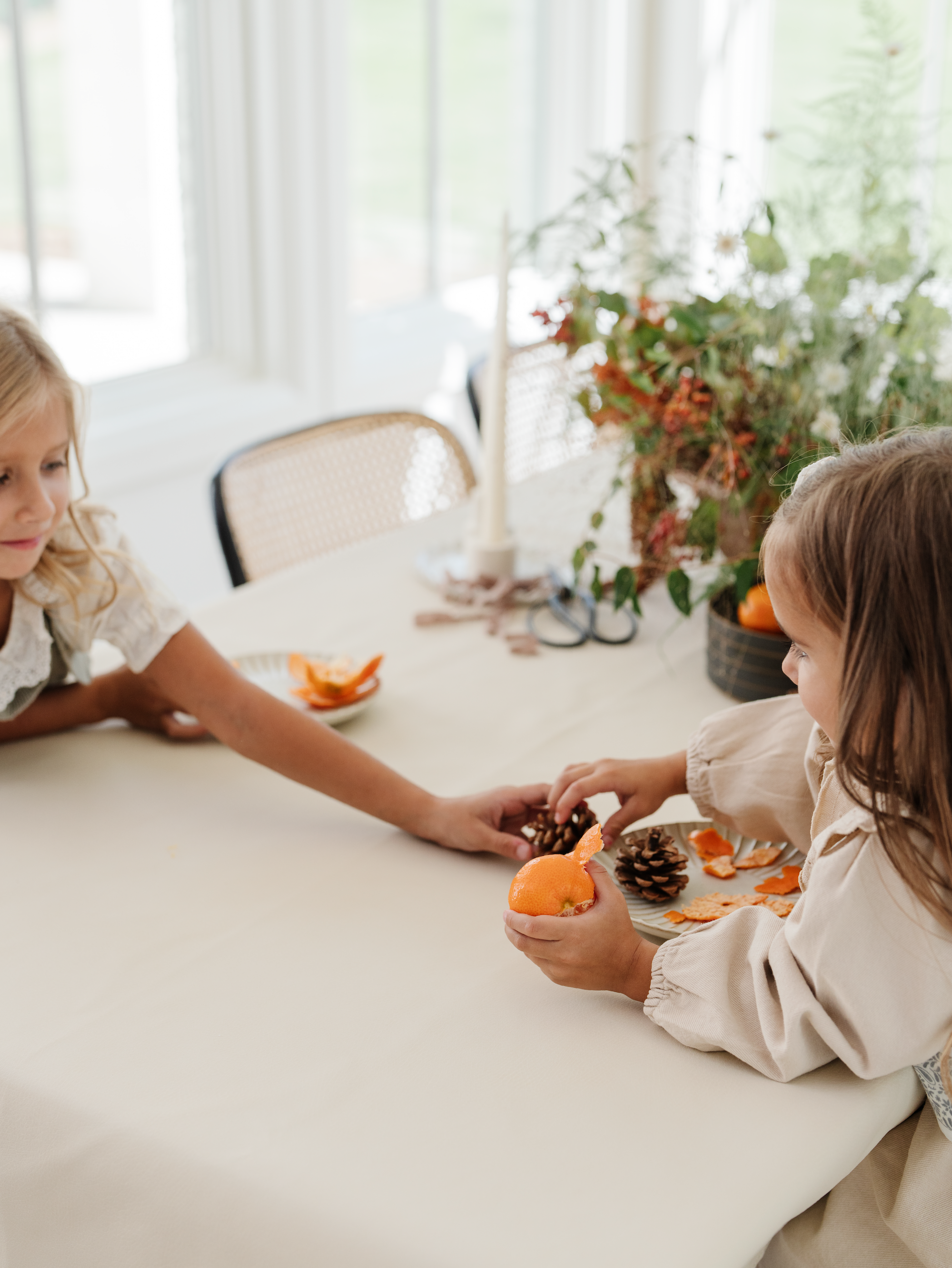 Kids sitting at a table with a Gathre Tablecloth on it.
