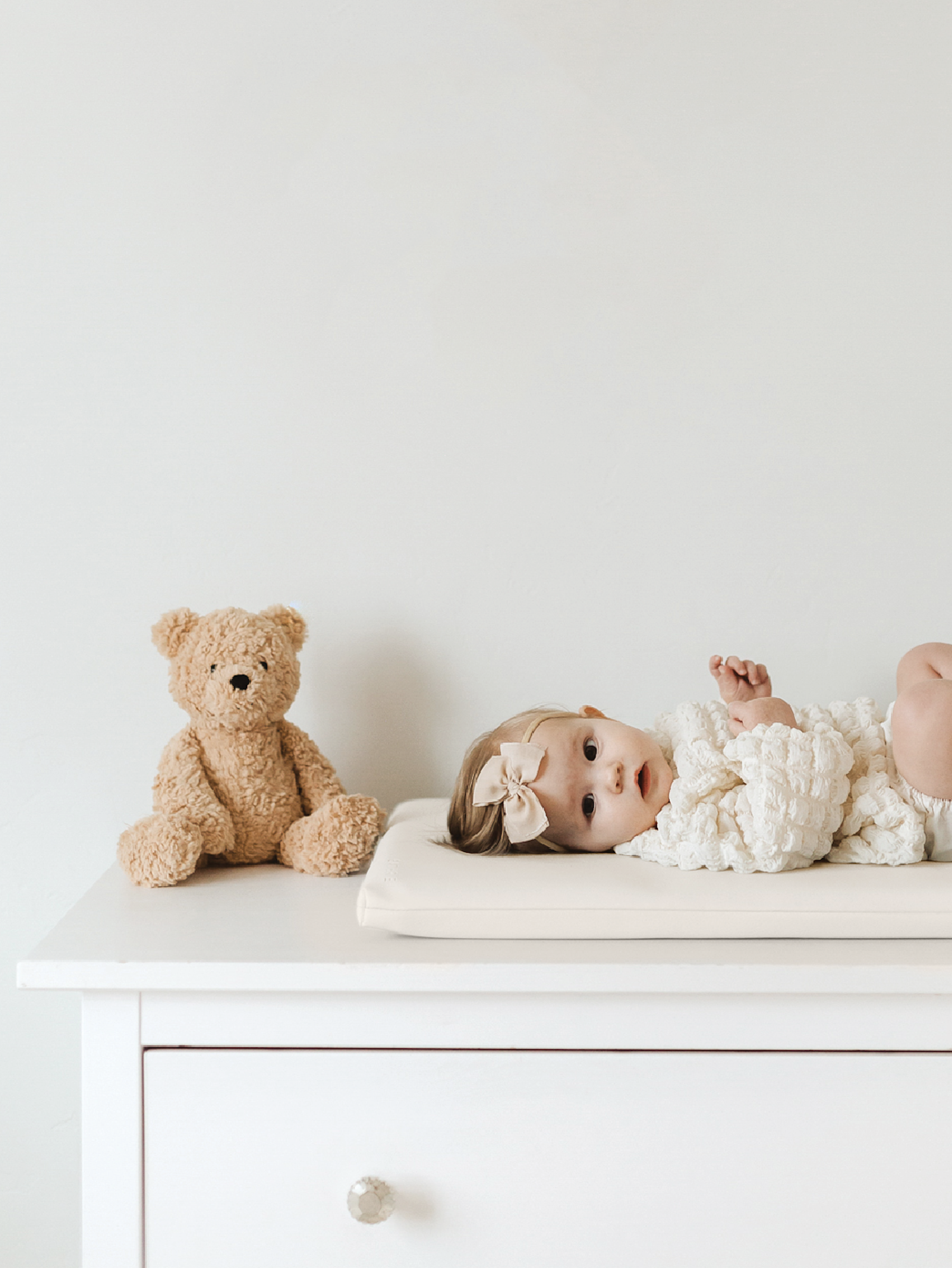 Baby laying on the Padded Micro+ Mat.