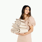 Mickey Mouse (on sale)@Woman holding a stack of Mickey Mouse Mats