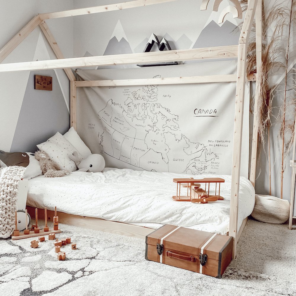 Canada Map (on sale)@Midi+ Canada Map hanging in bedroom above a bed