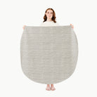 Stone Stripe / Circle@Woman holding the Stone Stripe Midi Circle Mat