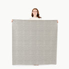 Stone Stripe / Square@Woman holding the Stone Stripe Midi Square Mat