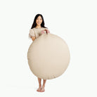 Millet / Circle@woman holding the Millet Circle Floor Cushion