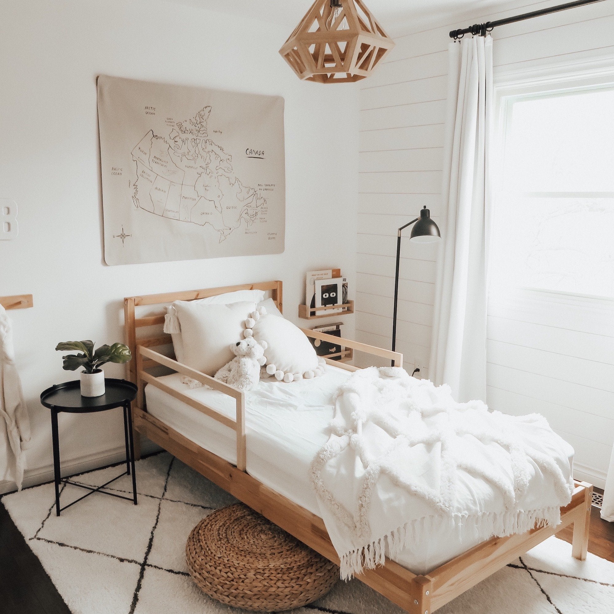 Canada Map (on sale)@Canada Map Mini+ Mat hanging in a bedroom above a bed