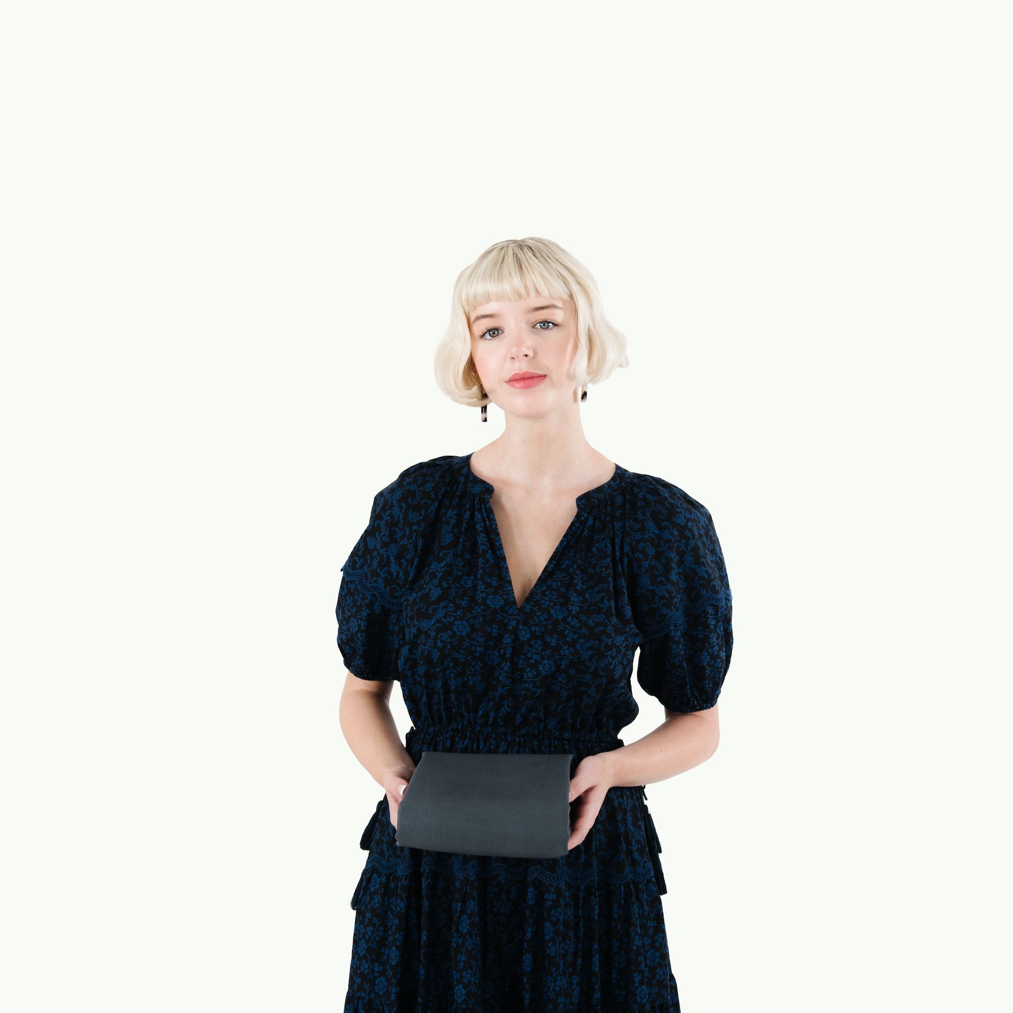 Nightfall (on sale)@Woman holding a folded Nightfall Mini Mat