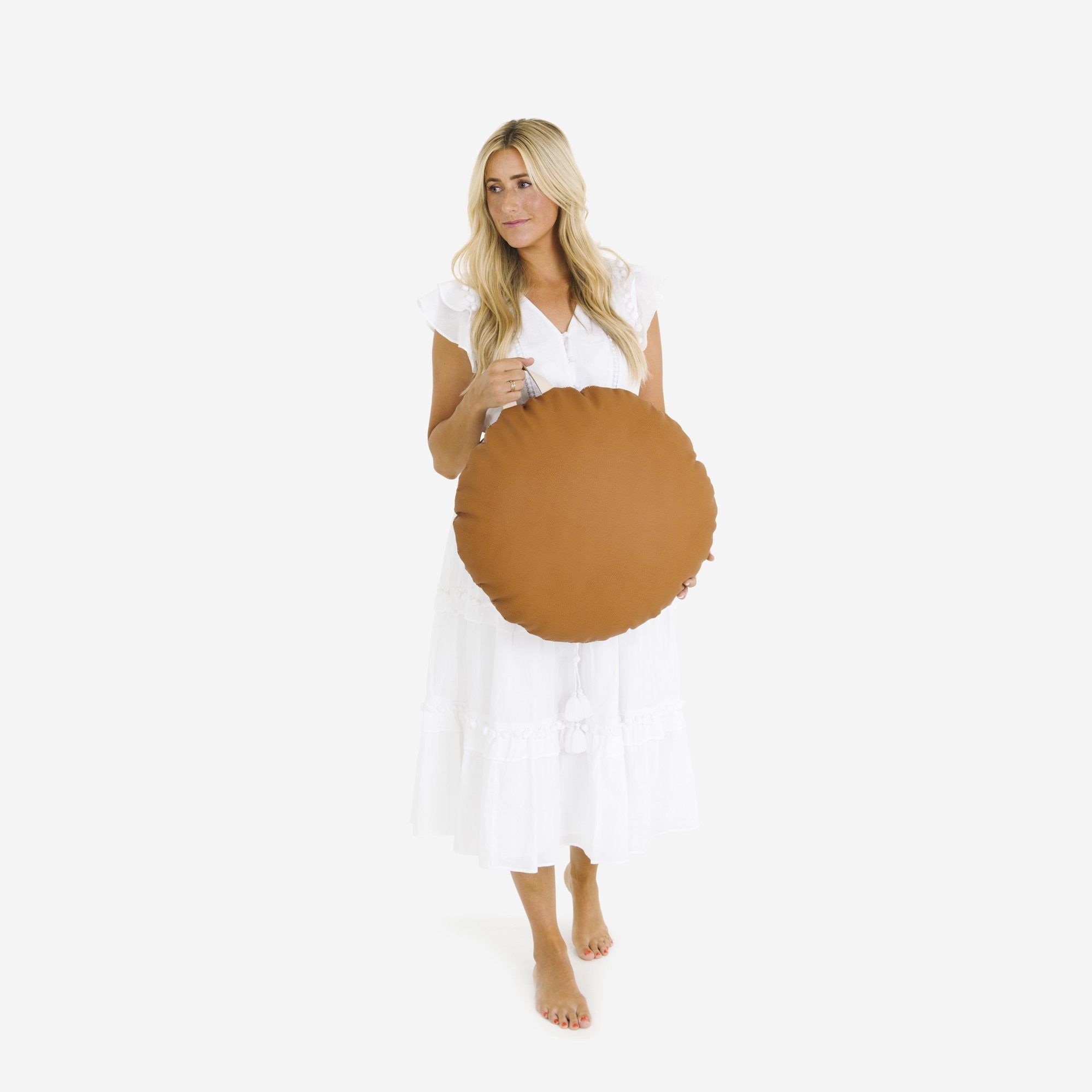 Ginger (on sale) / Circle@Woman holding the Ginger Circle Mini Floor Cushion