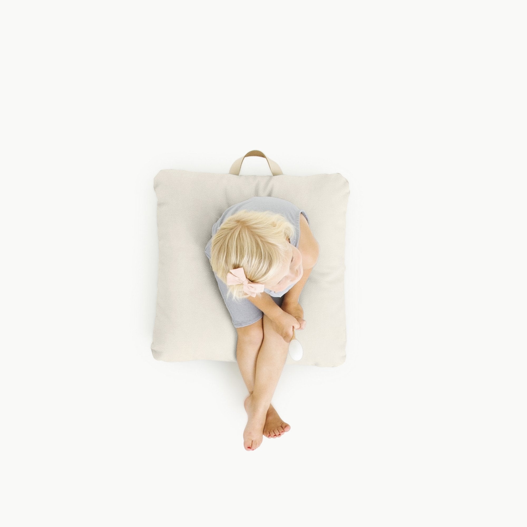 Blanc (on sale) / Square@Overhead of kid sitting on Blanc Square Mini Floor Cushion