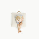 Blanc (on sale) / Square@Overhead of kid sitting on Blanc Square Mini Floor Cushion