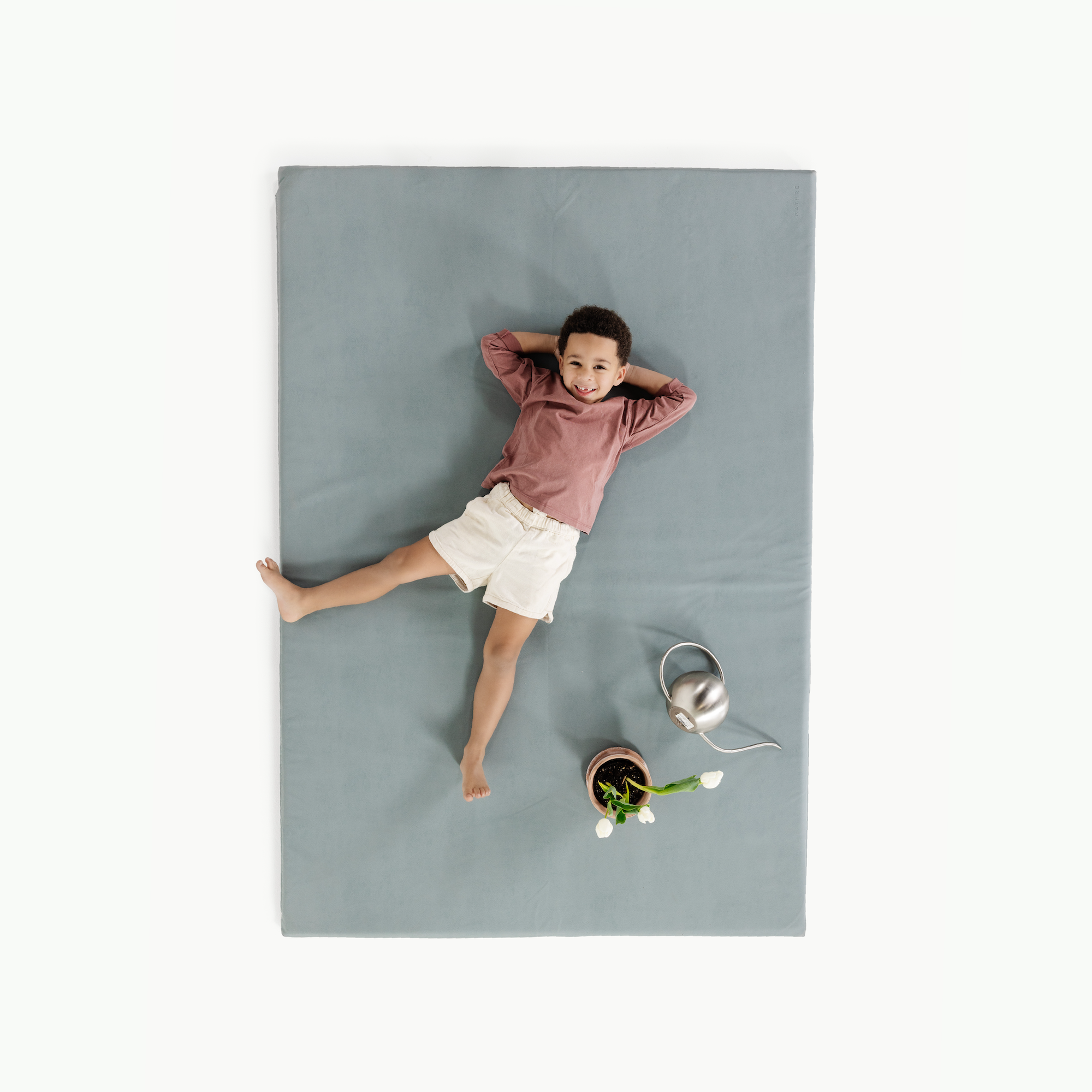 Amalfi (on sale)@overhead of little boy on mat