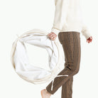 Parchment@Woman holding the folded Parchment Tunnel