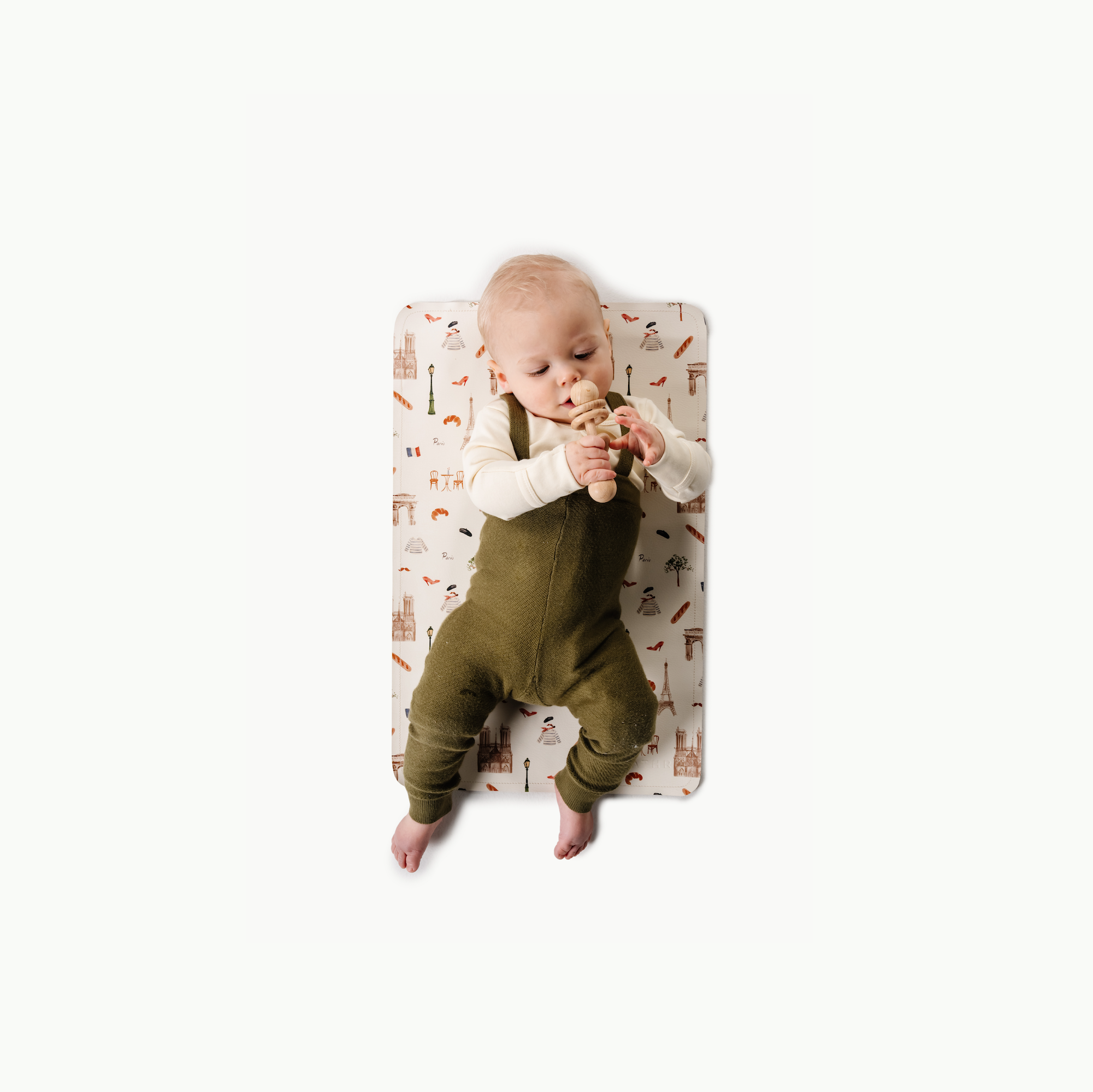 Paris@overhead of baby on the paris micro mat