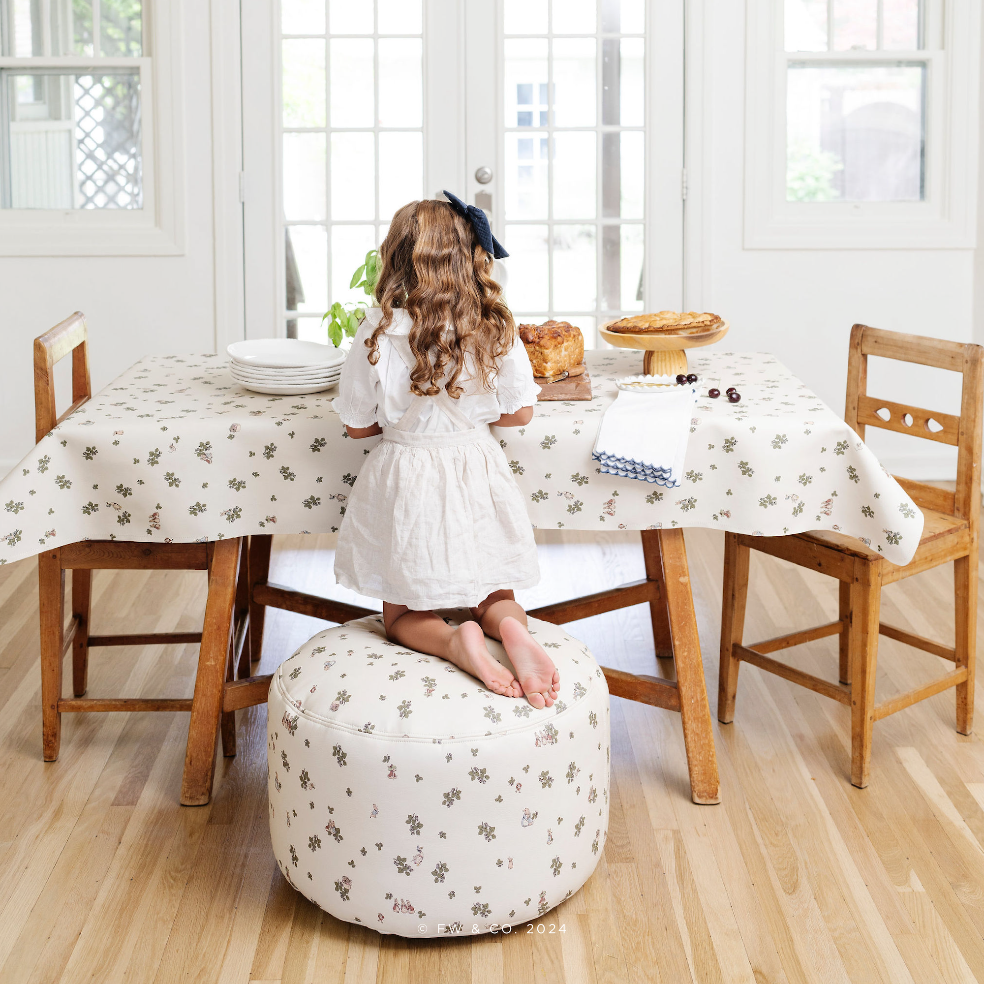 Peter Rabbit™ (on sale)@lifestyle image of little girl sitting on pouf