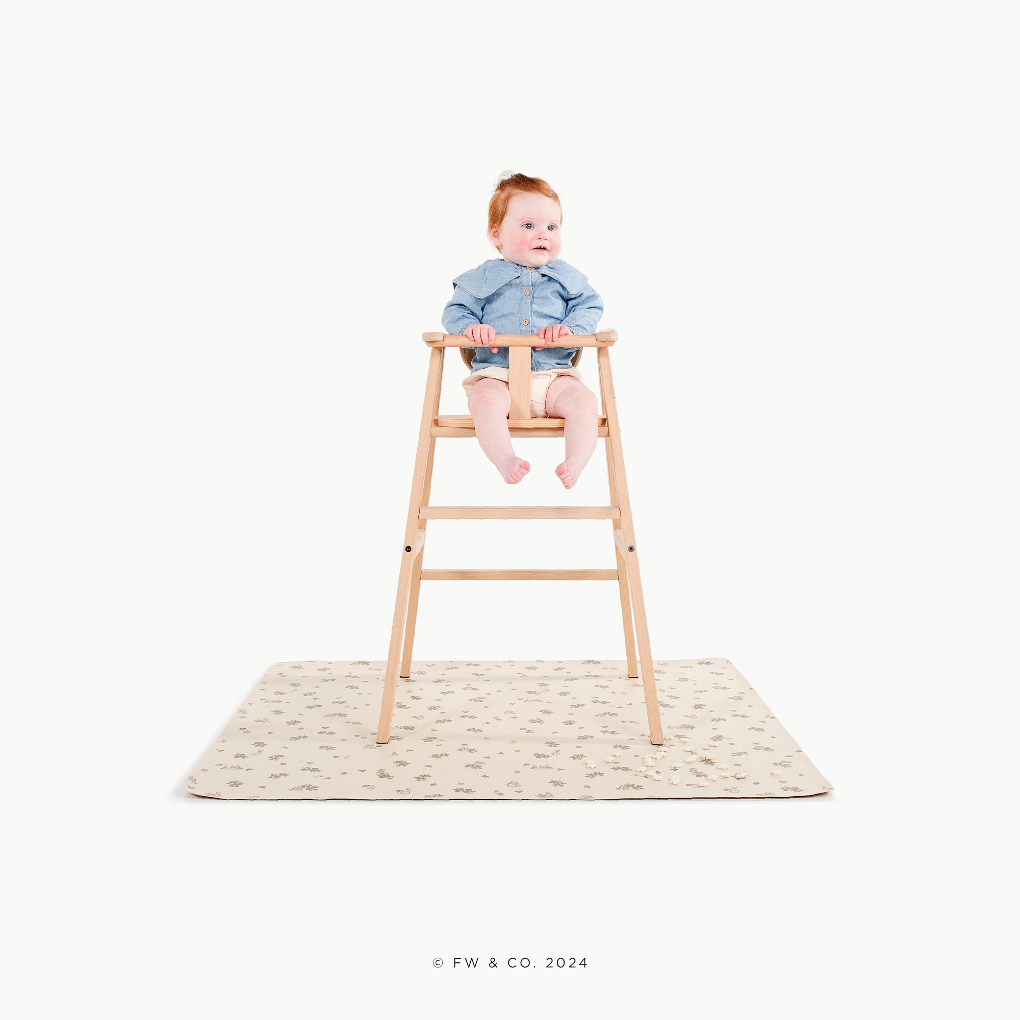 Peter Rabbit™ (on sale)@little girl in a high chair on a mat