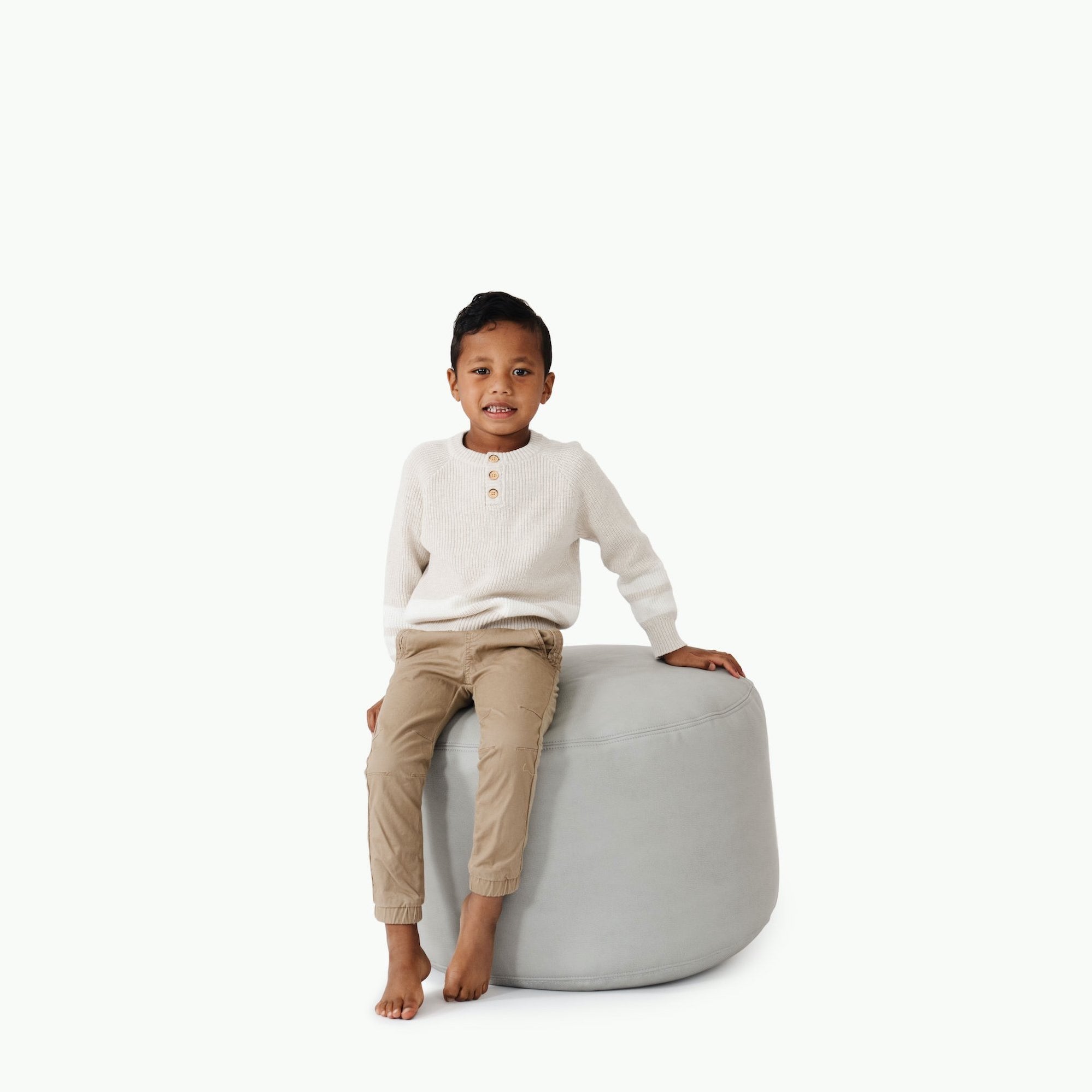 Pewter (on sale)@Kid sitting on the Pewter Circle Pouf