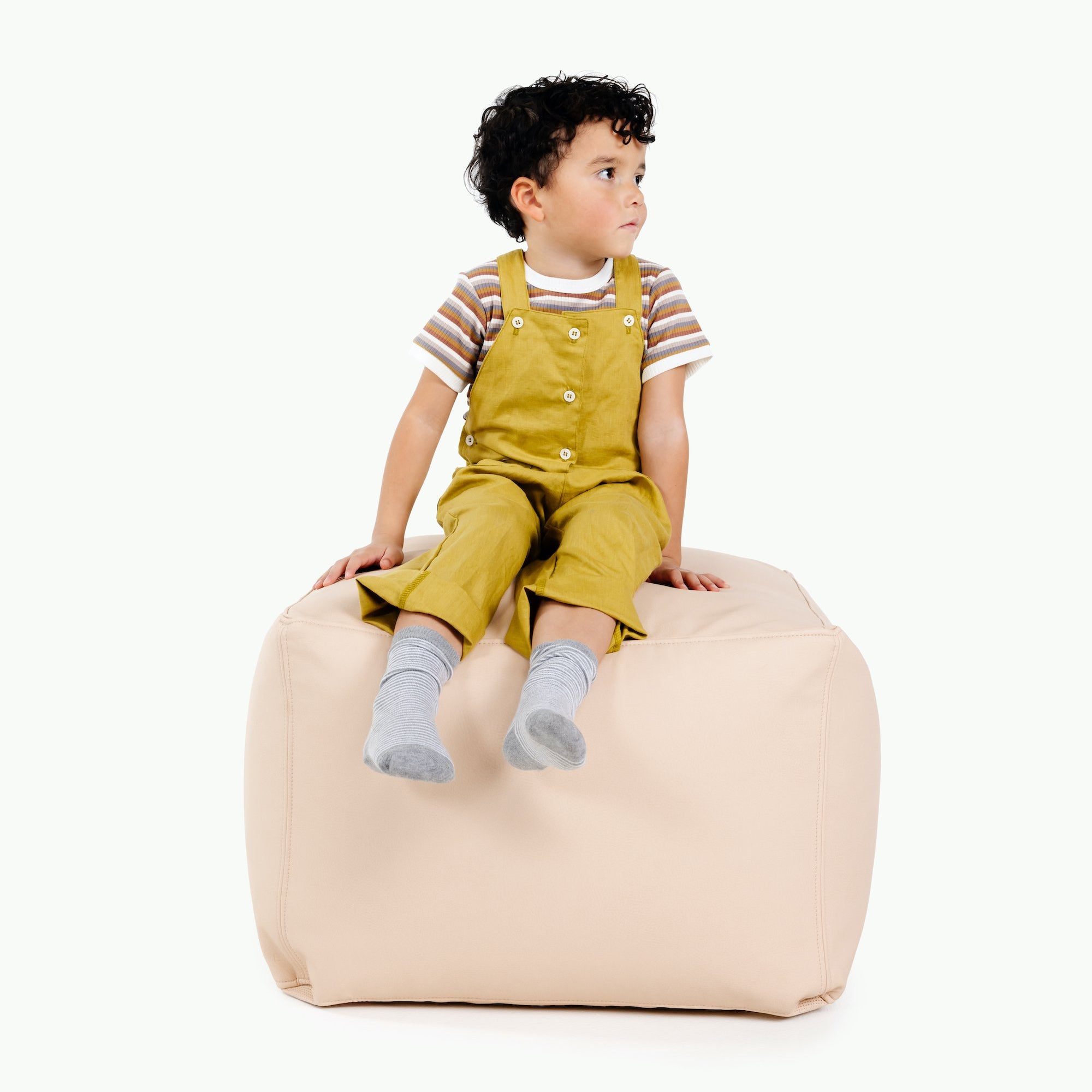 Pomelo (on sale)@Kid sitting on the Pomelo Square Pouf