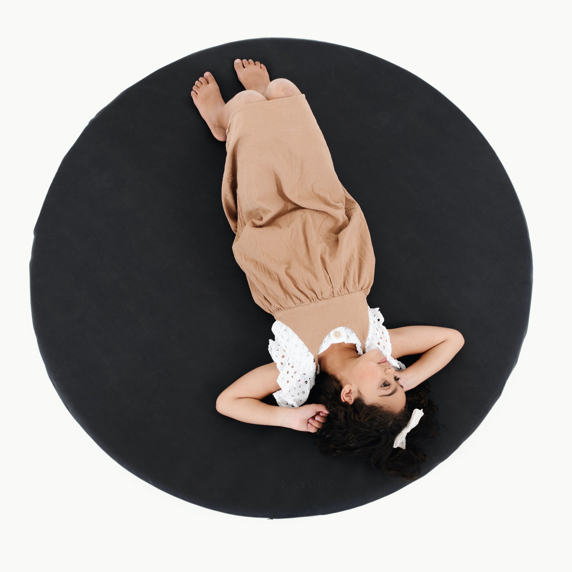 Raven (on sale)@Overhead of girl laying on Raven Padded Midi Circle