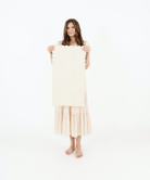 Blanc Scallop (on sale)@Woman holding the Blanc Scallop Micro+ Mat