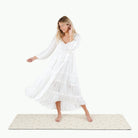 Tiny Rainbow (on sale)@Woman walking on the Large Tiny Rainbow Home Mat