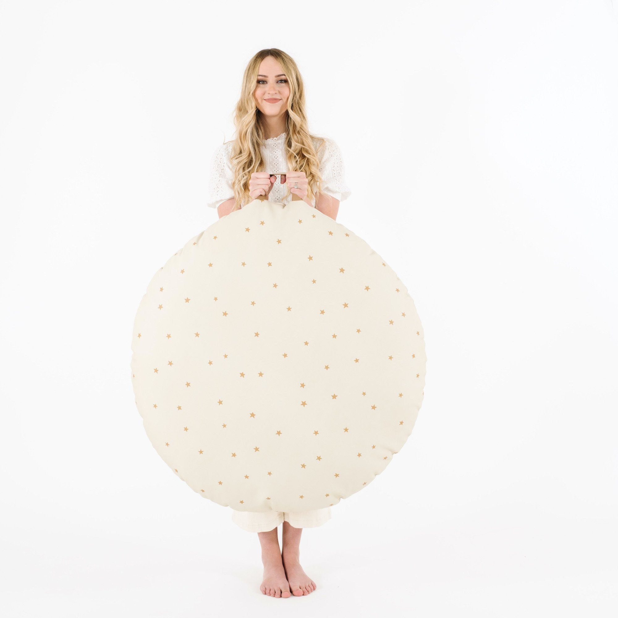 Stars (on sale) / Circle@Woman holding the Stars Circle Floor Cushion