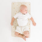 Stars (on sale)@Overhead of baby laying on the Stars Micro+ Mat