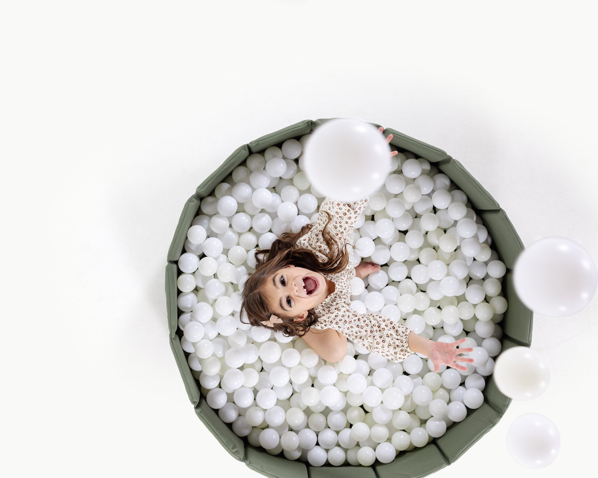 Thyme@Overhead of kid playing in the Thyme Ball Pit