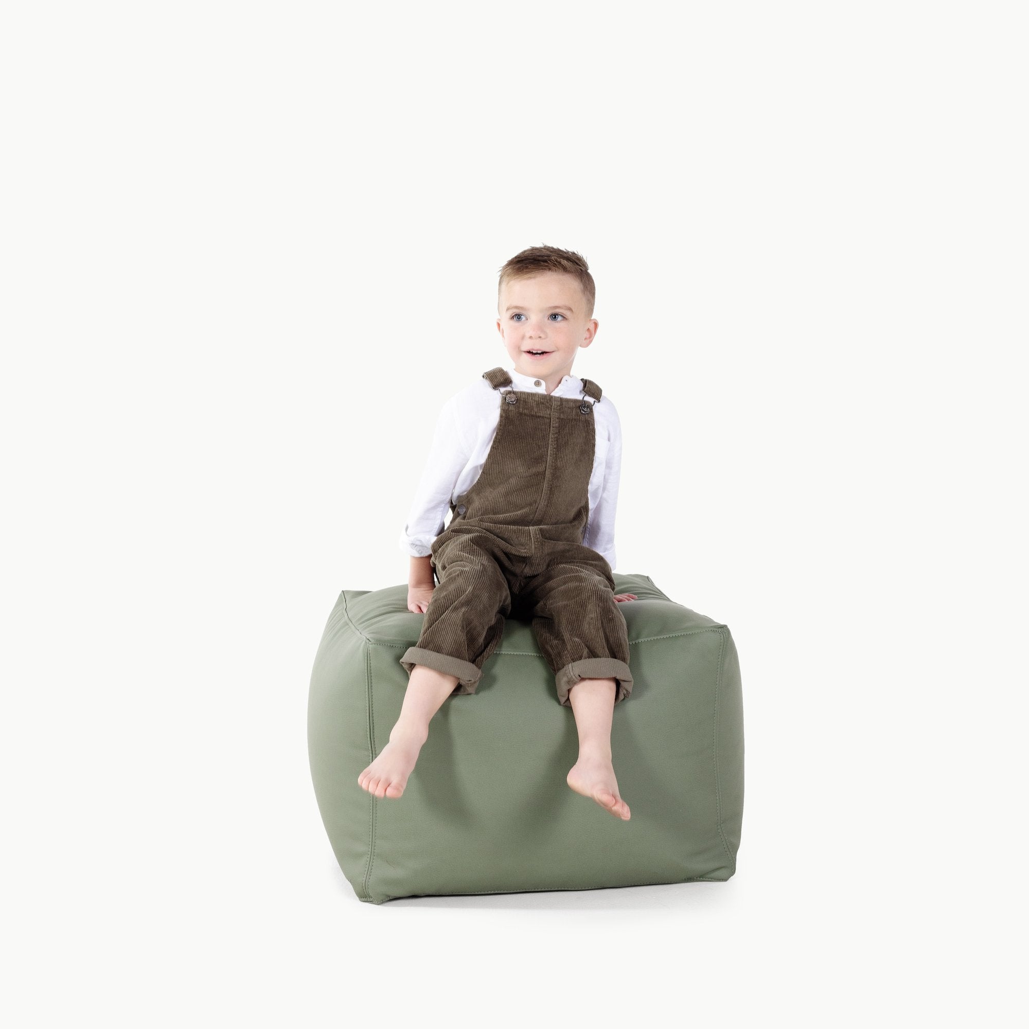 Thyme@Kid sitting on a Thyme Square Pouf