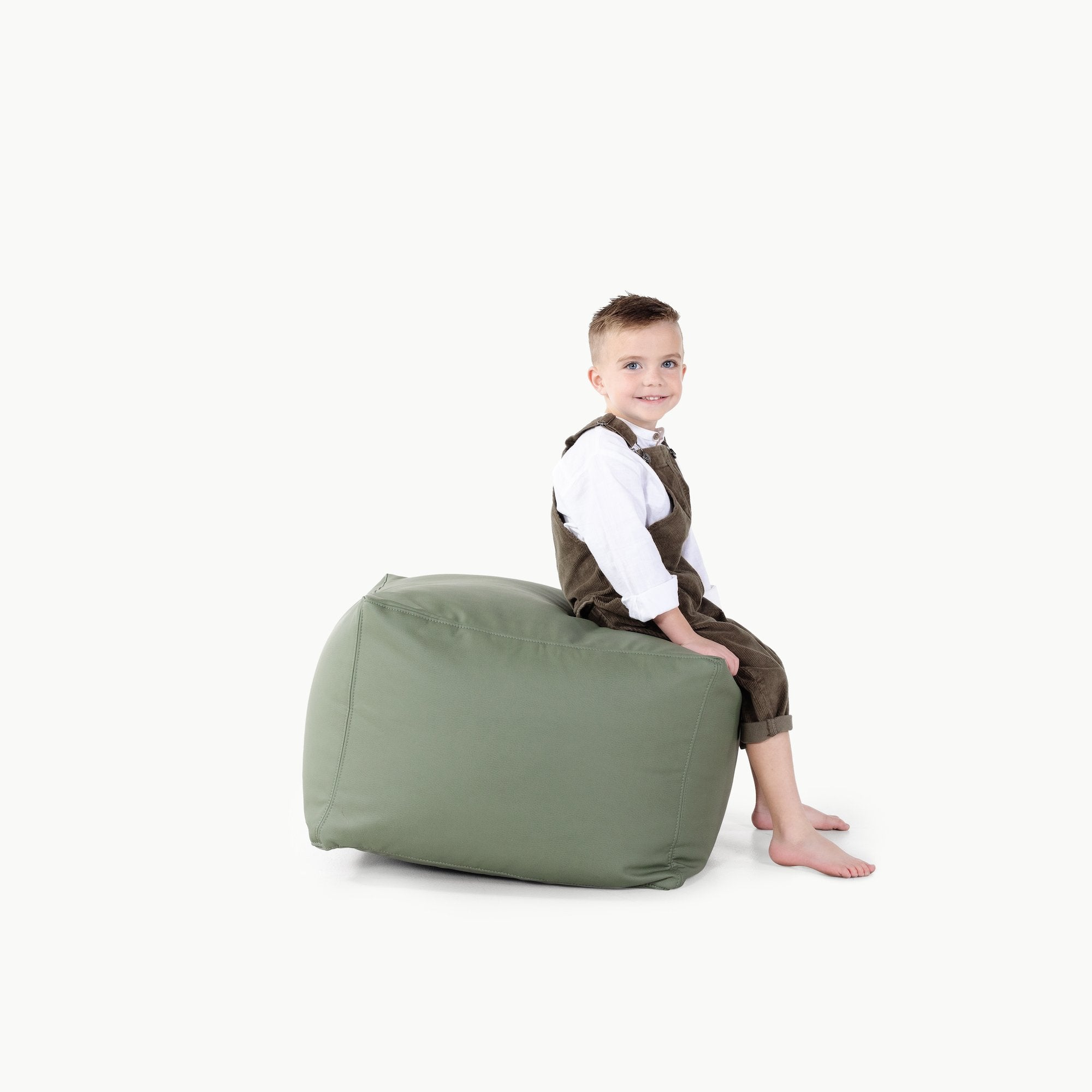 Thyme@Kid sitting on a Thyme Square Pouf