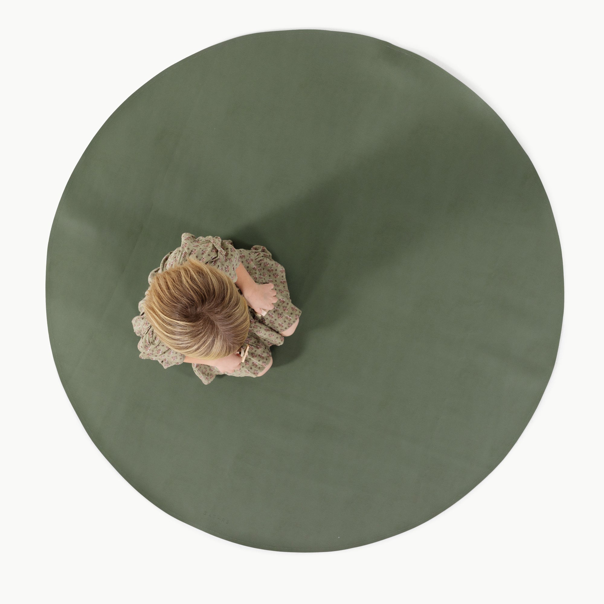 Thyme / Circle@Overhead of kid sitting on the Thyme Midi Circle Mat