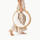 Untanned (on sale)@Woman holding the Untanned Tunnel folded up