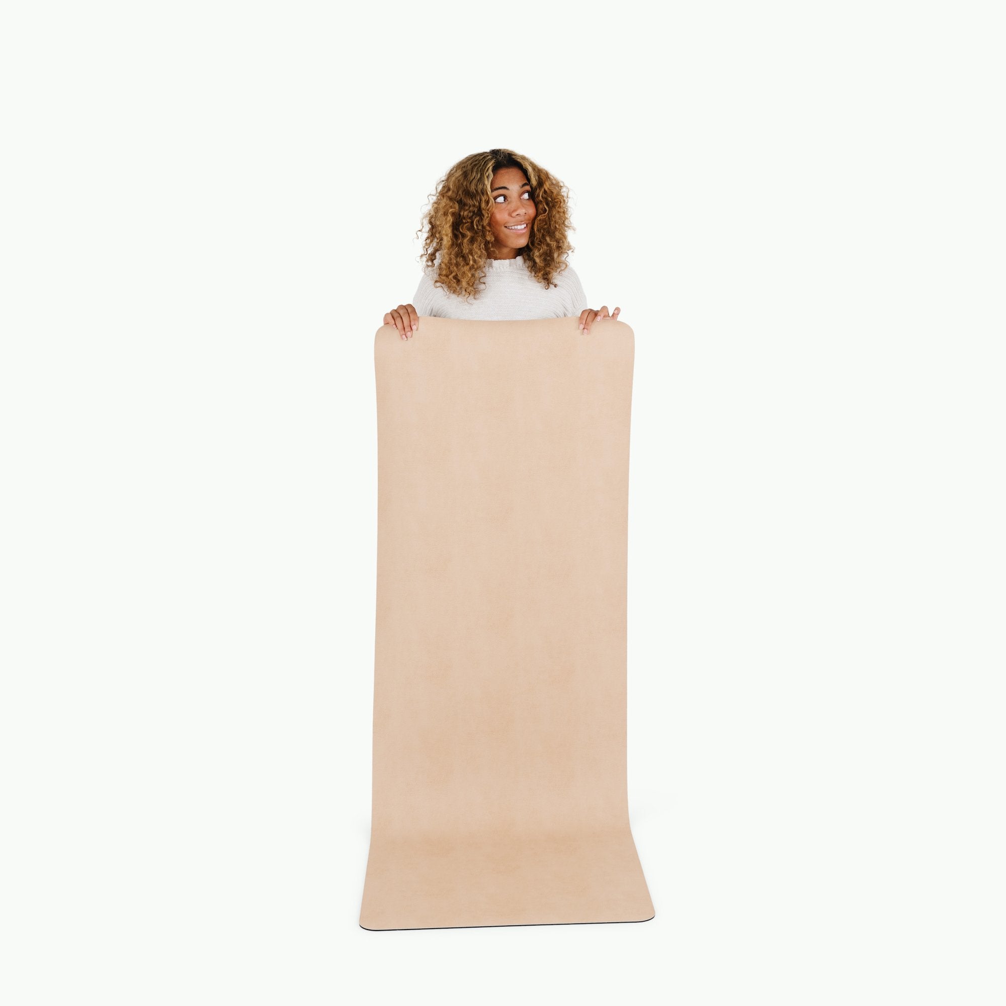Untanned (on sale)@woman holding up the untanned large home mat