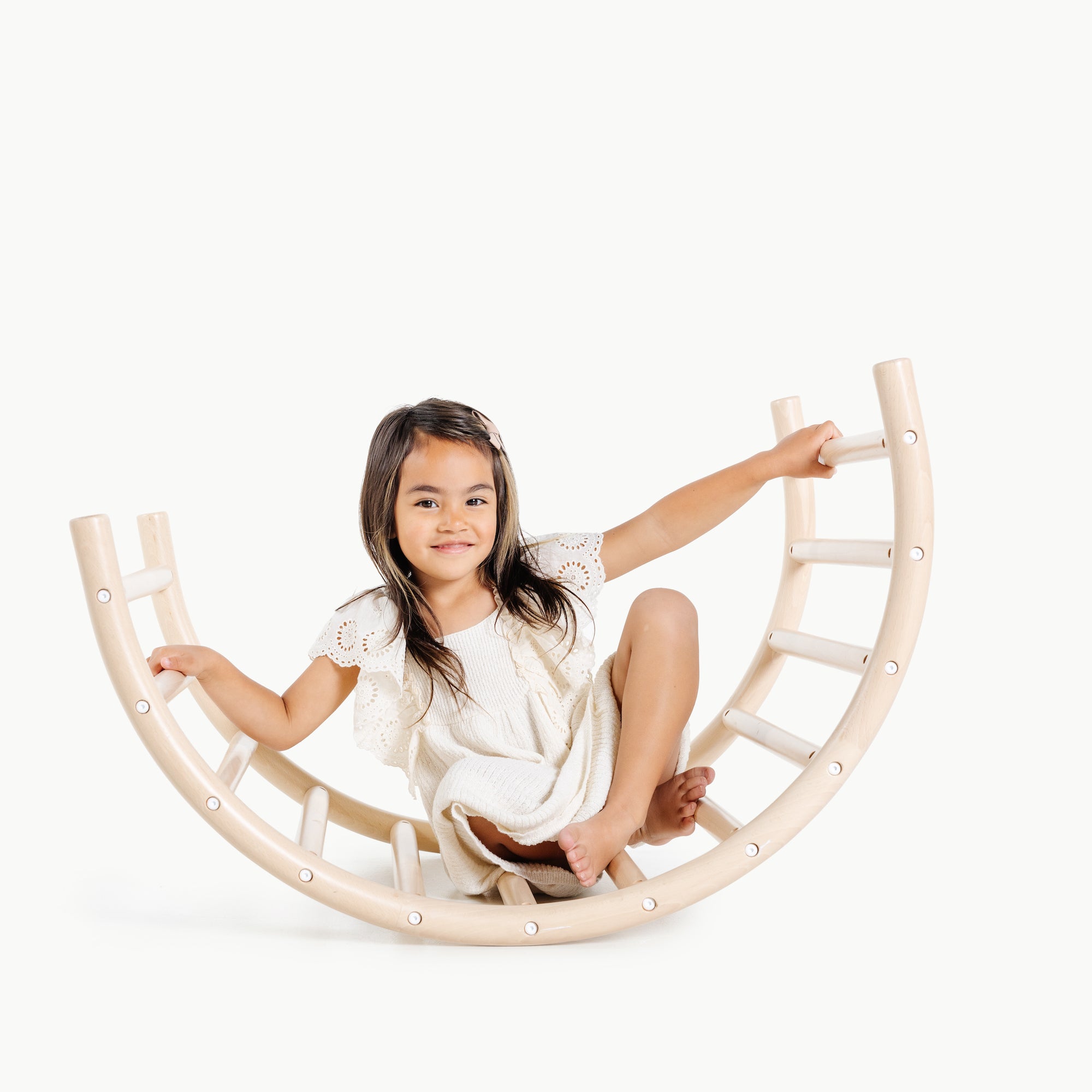 Beech@little girl sitting on Play Gym