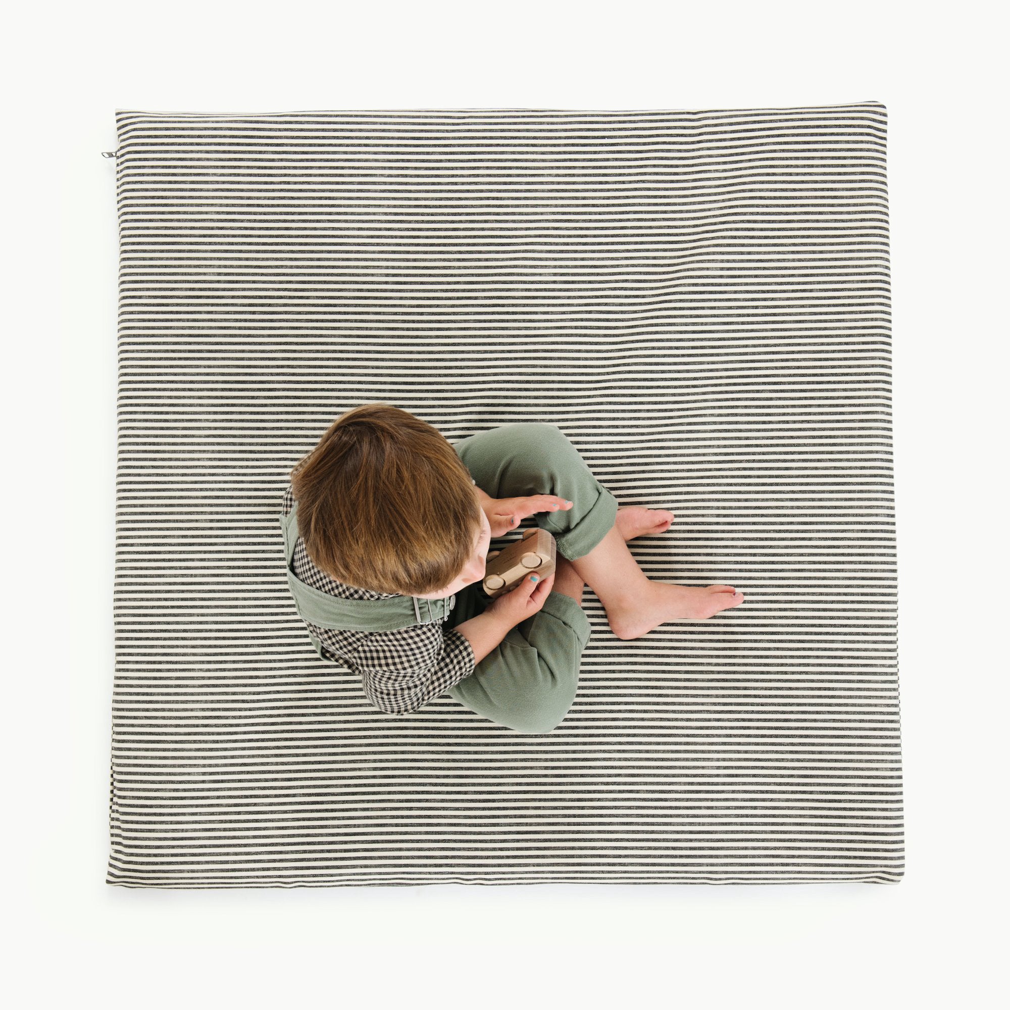 Stone Stripe / Square@Overhead of boy sitting on Stone Stripe Padded Mini Square