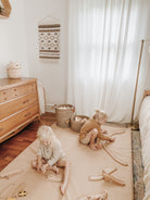 Untanned (on sale)@Kid playing in room on Untanned Padded Midi+