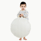 Meadow / Circle@kid holding up the meadow circle mini circle floor cushion