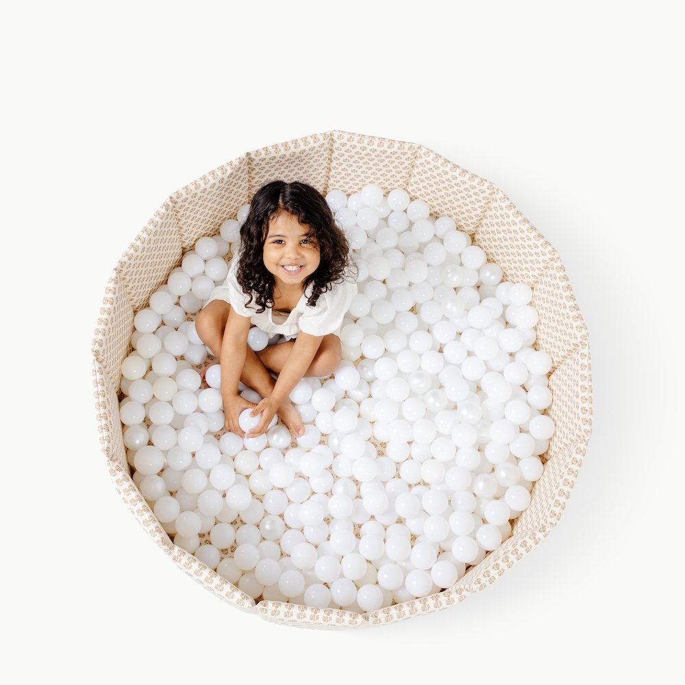 Bloom (on sale)@Overhead of girl playing in Bloom Ball Pit