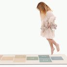 Rainbow Hopscotch@kid playing on the rainbow hopscotch mat