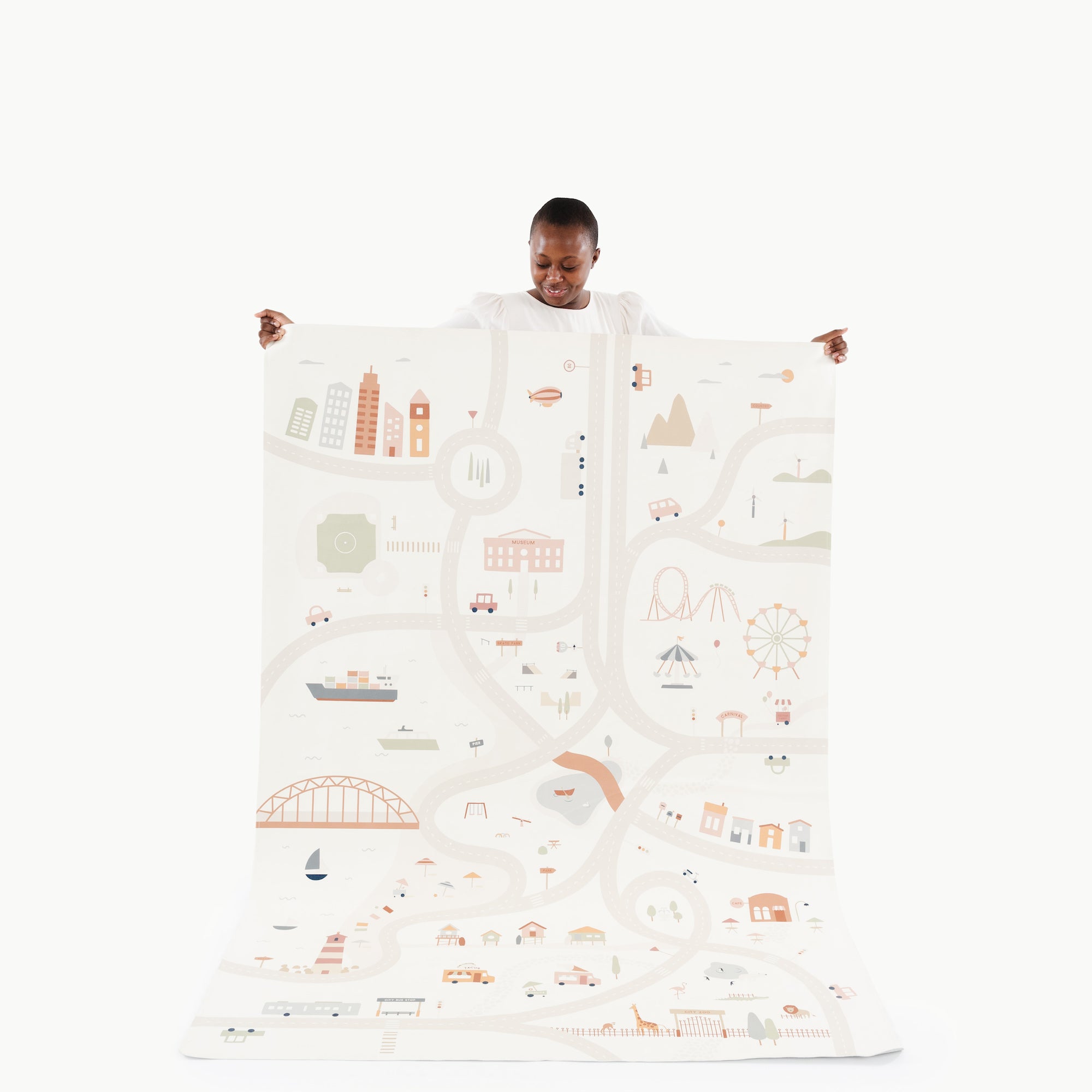 Uptown@woman holding the midi+ uptown mat