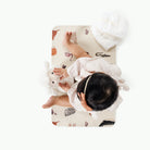Menagerie@Overhead baby sitting on the Menagerie Micro mat